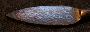 forged blade showing small hammer marks from cold peining