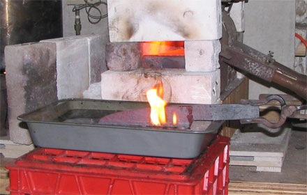 smoke and flames while heat treating a blade
